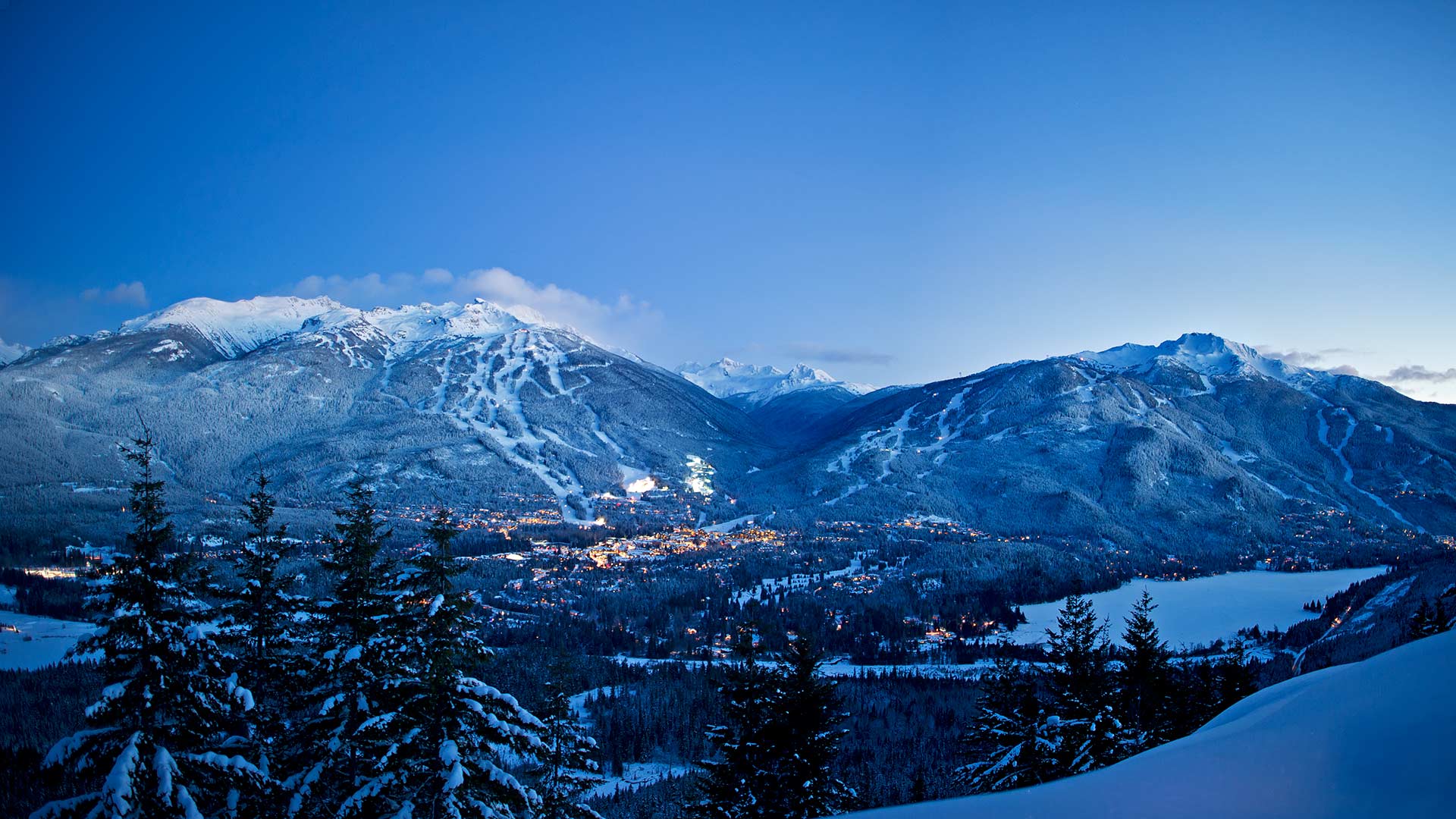 Winter-Dual-Mountain-Evening-Lights-Snowy-Trees-Village-DavidMcColm